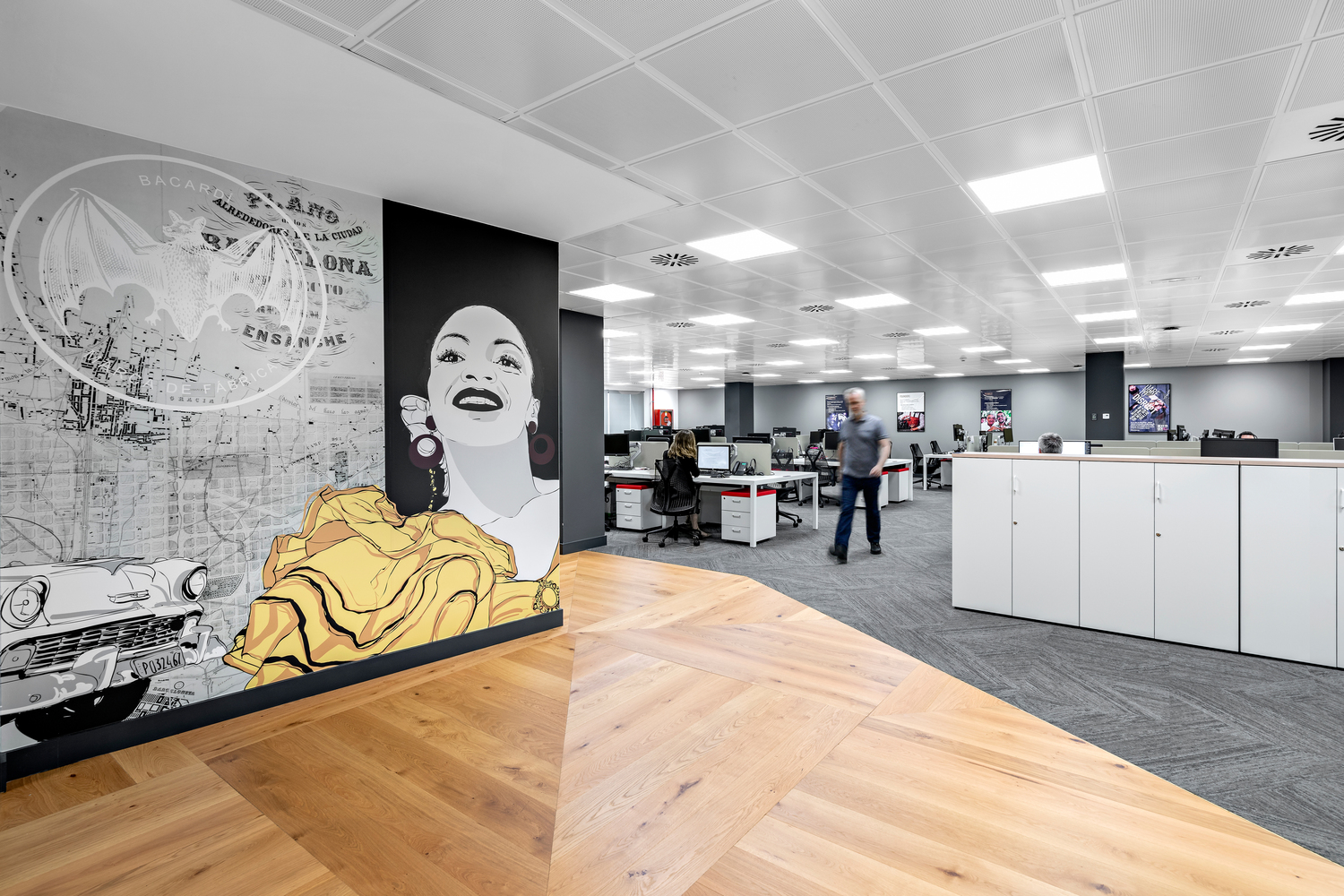 IA -Interior Architects -BACARDI BARCELONA OFFICE Wall with woman and the bat.